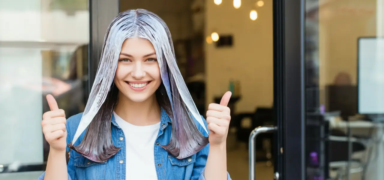 "Happy customer leaving salon with fresh hair color after learning hair color salon prices."